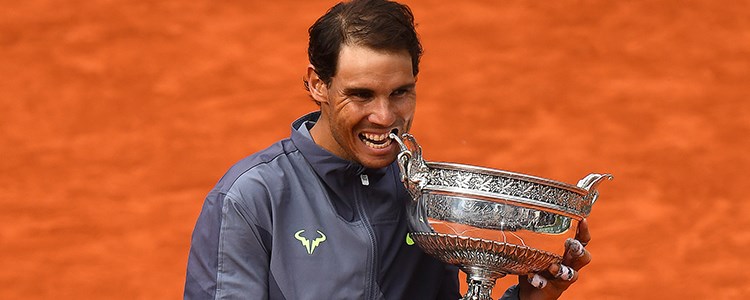Rafael Nadal biting his trophy 