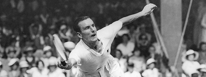 Fred Perry reaching for a forehand shot