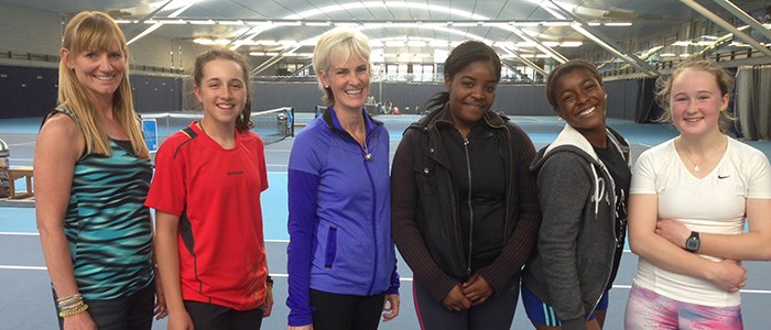 Judy Murray smiling with five junior tennis players