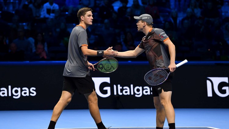 Henry Patten and Harri Heliovaara high five in the Nitto ATP Finals