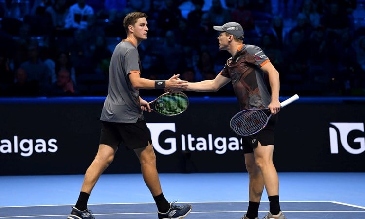 Henry Patten and Harri Heliovaara high five in the Nitto ATP Finals