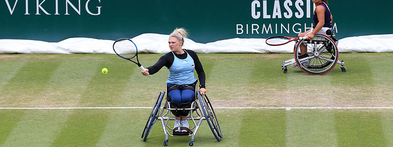 Jordanne Whiley returning a shot in a tennis match
