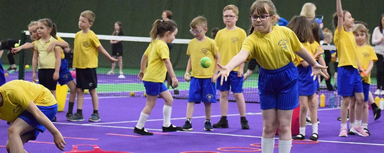 Children at a tennis coaching session