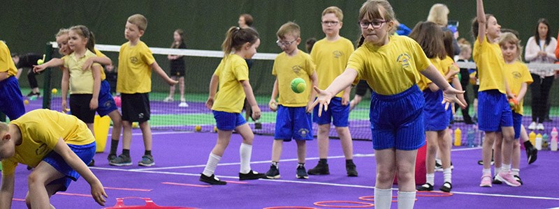 Children at a tennis coaching session