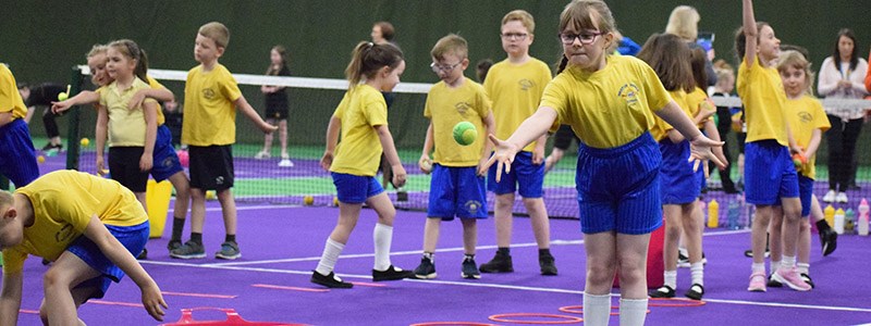 Children at a tennis coaching session