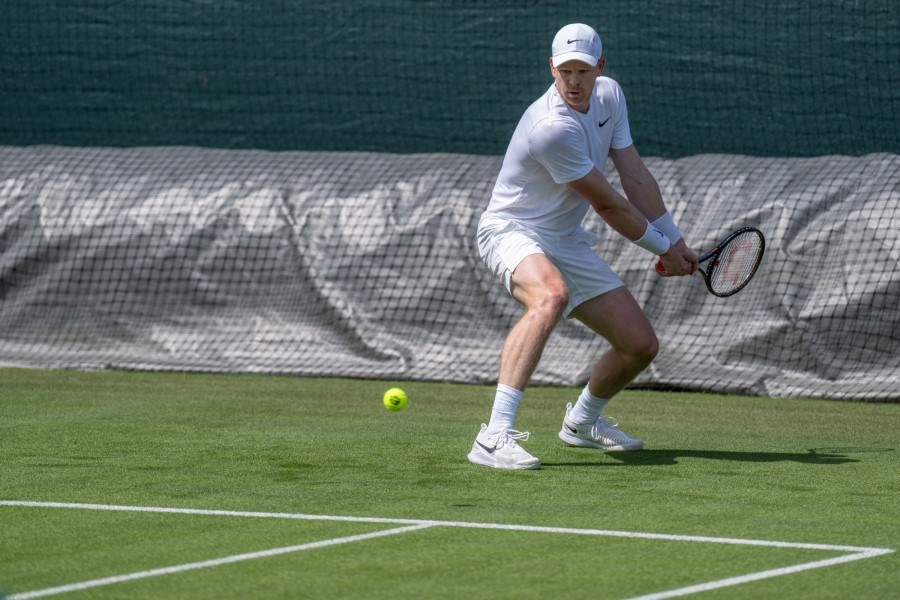 Kyle Edmund hitting a forehand in practice at Wimbledon