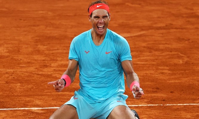 Rafael Nadal celebrating on court after his 13th French Open win