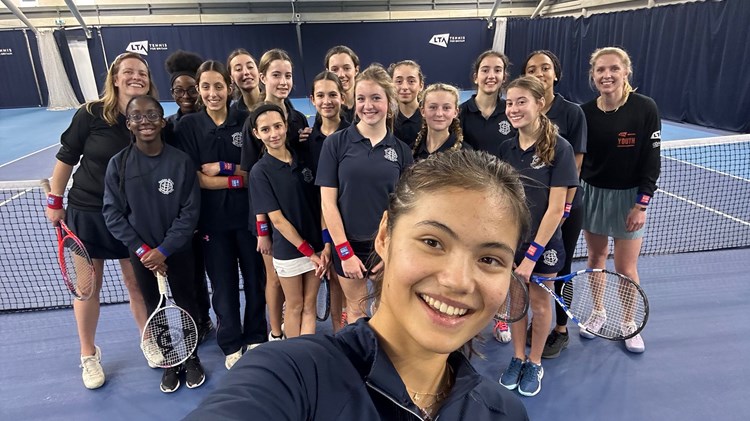 Emma Raducanu takes a selfie with an LTA Youth Tennis Leaders group from Sacred Hearts School
