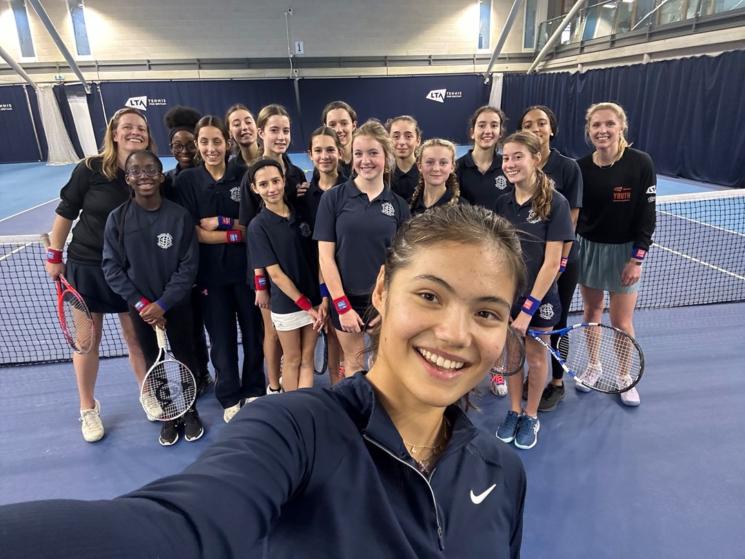 Emma Raducanu takes a selfie with an LTA Youth Tennis Leaders group from Sacred Hearts School