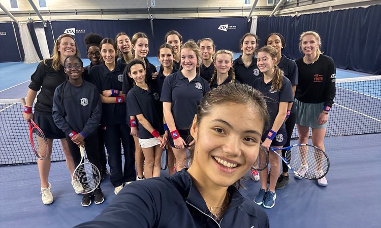 Emma Raducanu takes a selfie with an LTA Youth Tennis Leaders group from Sacred Hearts School