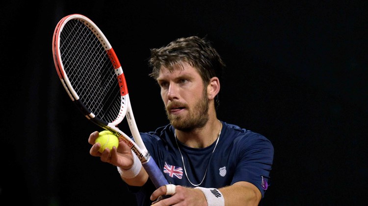 Cam Norrie serving in Great Britain's tie against Colombia in the Davis Cup