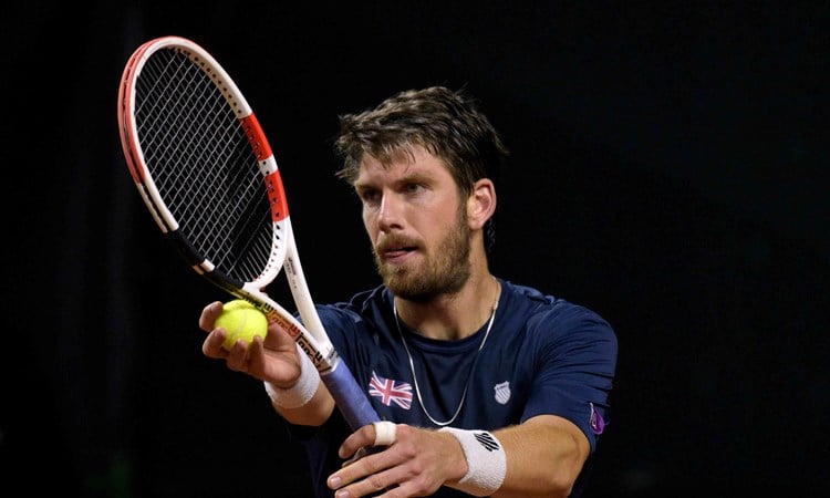 Cam Norrie serving in Great Britain's tie against Colombia in the Davis Cup