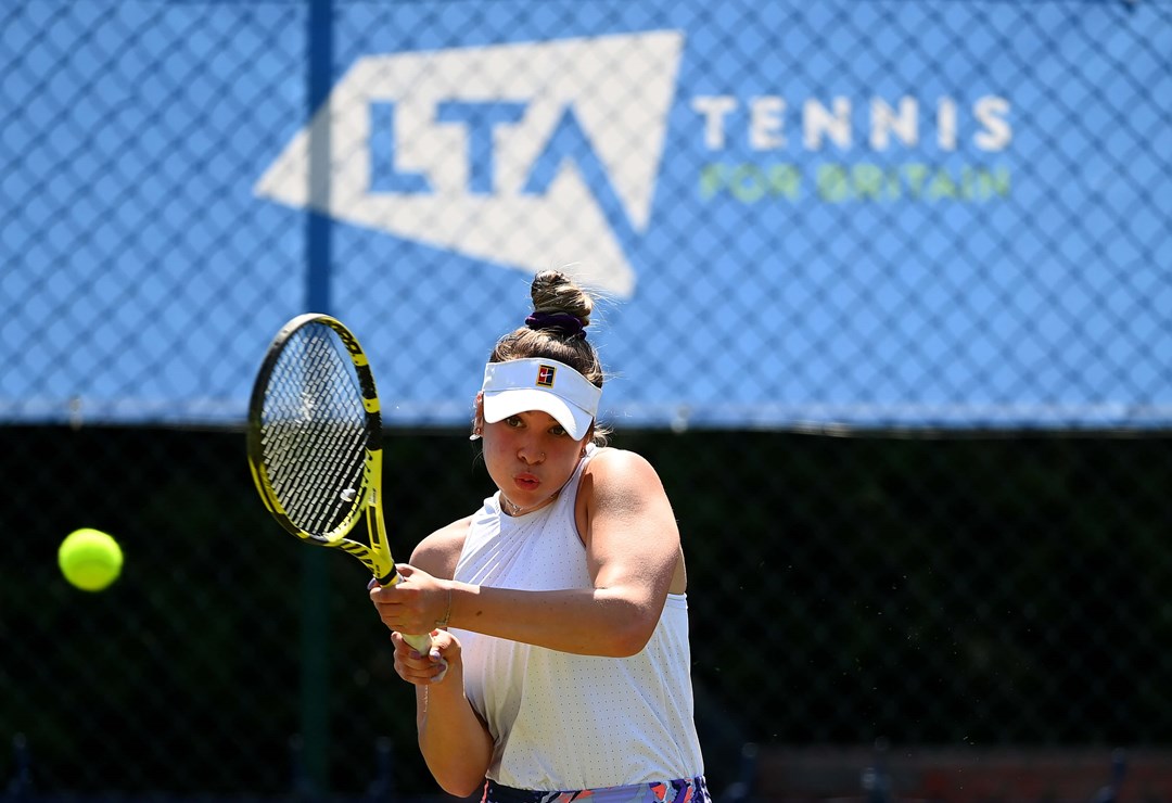 Eva Shaw hits a forehand during her singles match against Hannah Read in the Junior National Tennis Championships at Surbiton Racket & Fitness Club on June 01, 2021 in Surbiton, England.