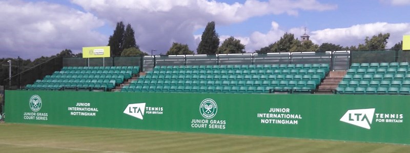 image of chairs and court at nottingham grass courts with lta tennis logo shown