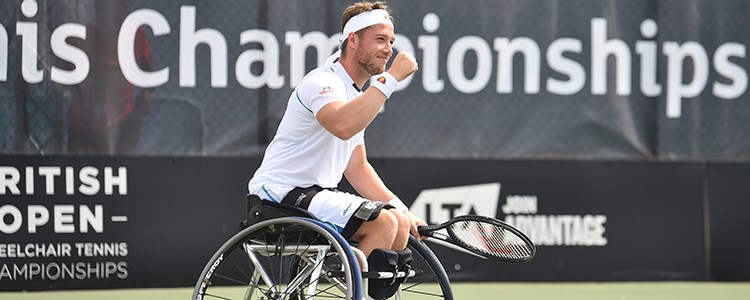 Alfie Hewett celebrating with a smile on his face on a tennis court
