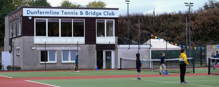 two tennis courts and clubhouse at the back at dunfemline tennis club