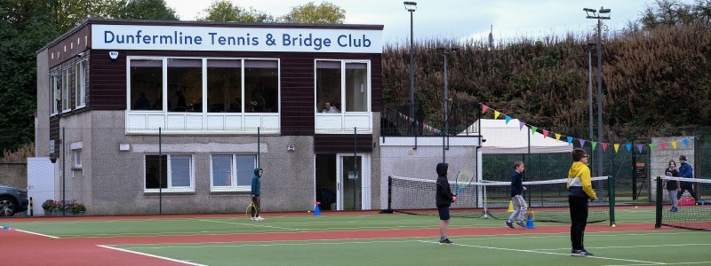 two tennis courts and clubhouse at the back at dunfemline tennis club