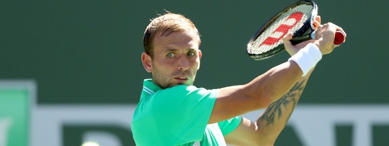 close up of dan evans about to hit a volley