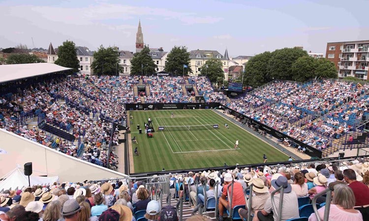 General view of tennis fans watching on court at the Rothesay International Eastbourne with the sun going down