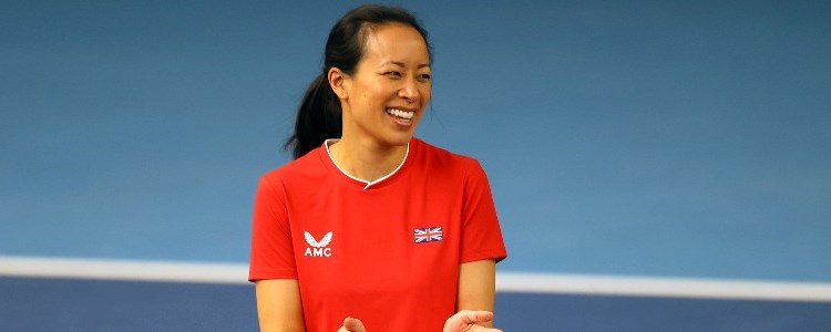 Anne Keothavong smiling for a picture and clapping