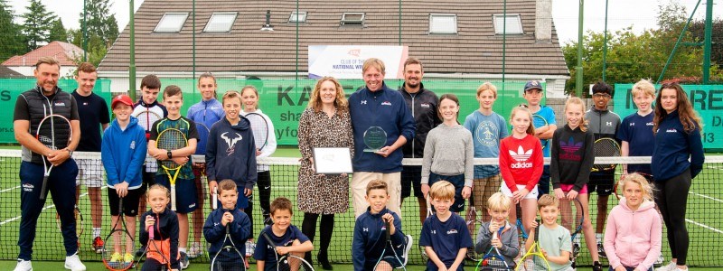 Gourp of kids holding rackets