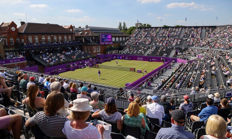 Grass court stadium filled with fans