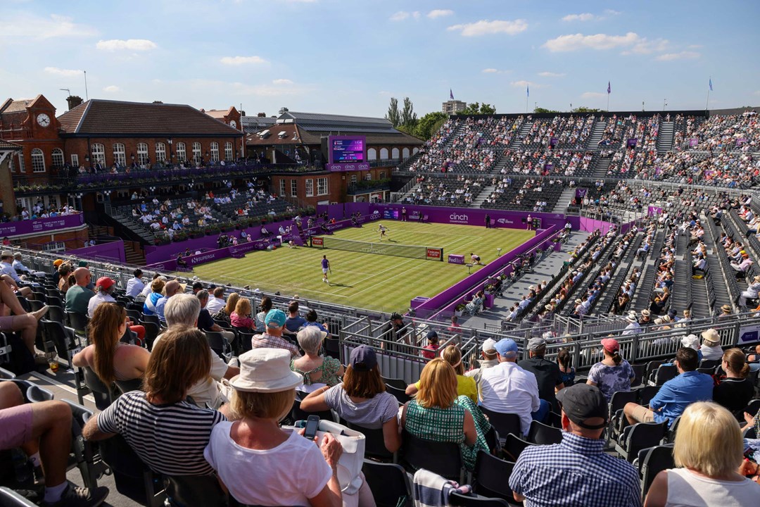 Grass court stadium filled with fans