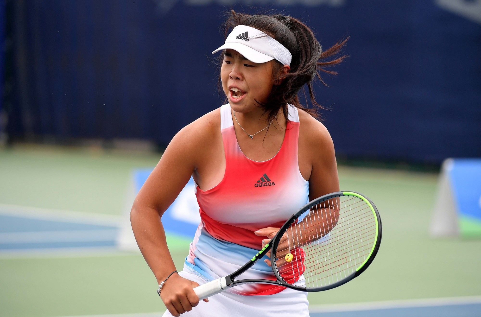 Female tennis player holding a racket