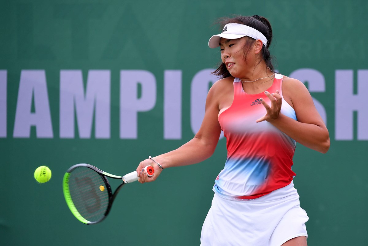 Female tennis player swinging her racket