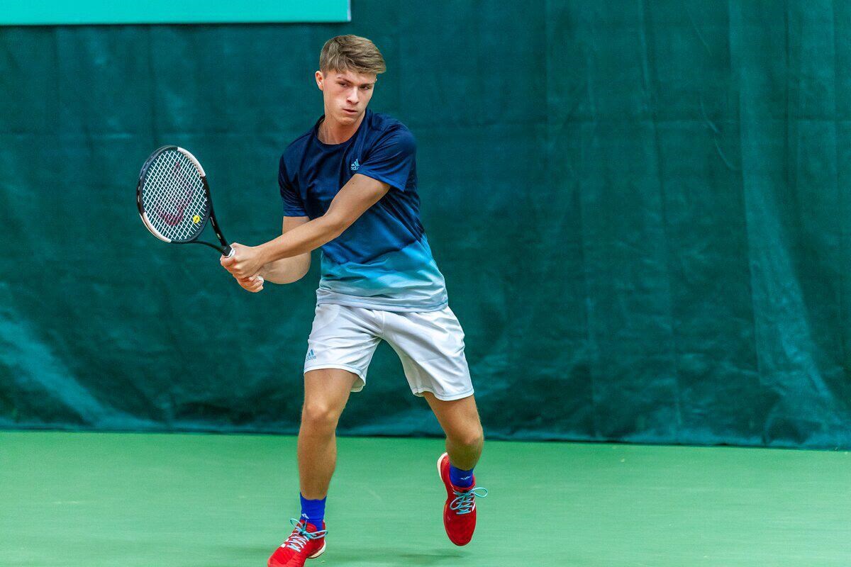 James returning a shot mid tennis game