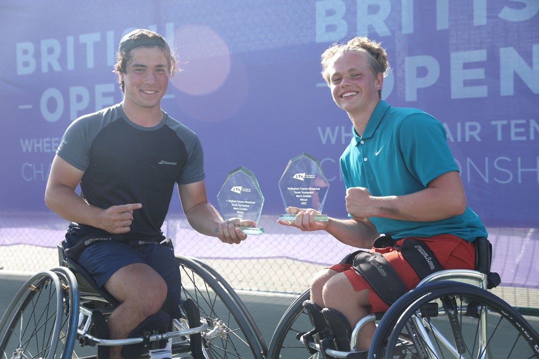 Handicapped players holding trophies