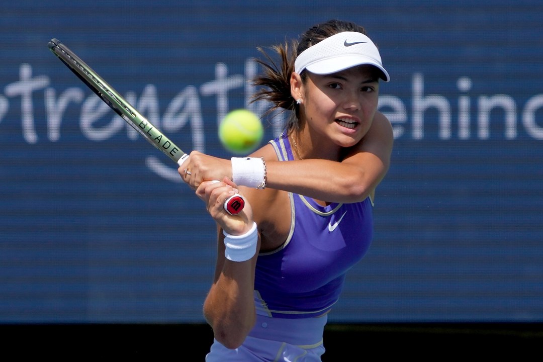 Emma Raducanu swinging a tennis racket