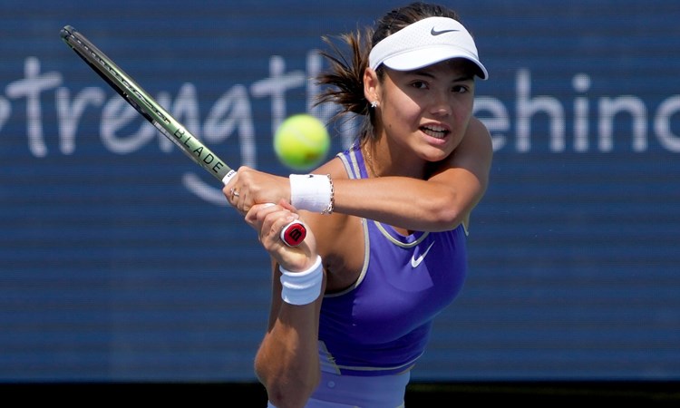 Emma Raducanu swinging a tennis racket