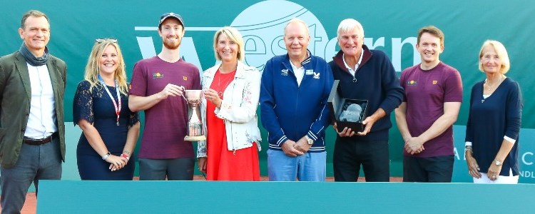 A group of people presenting their trophie