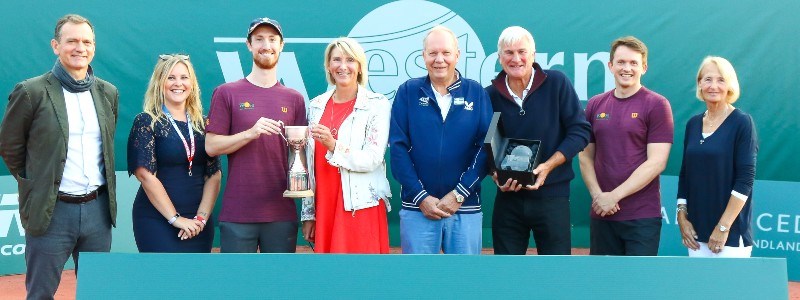 A group of people presenting their trophie