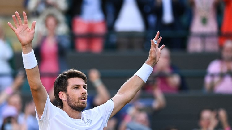 Cam Norrie raising his hands to the crowd