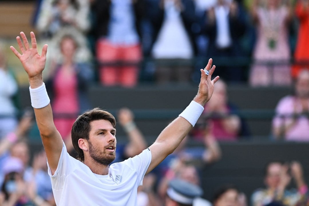 Cam Norrie raising his hands to the crowd