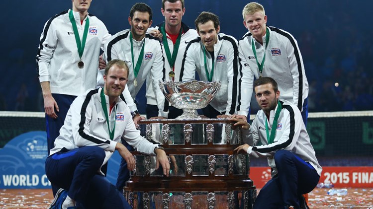 Great Britain players standing around a big trophy