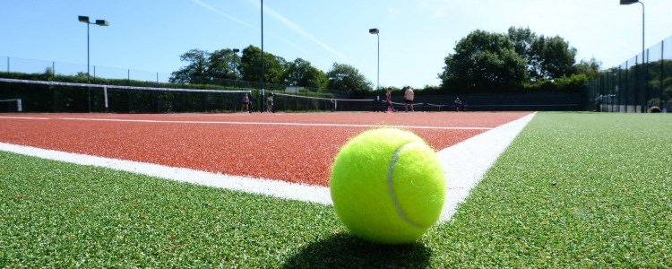 Tennis ball on a clay court