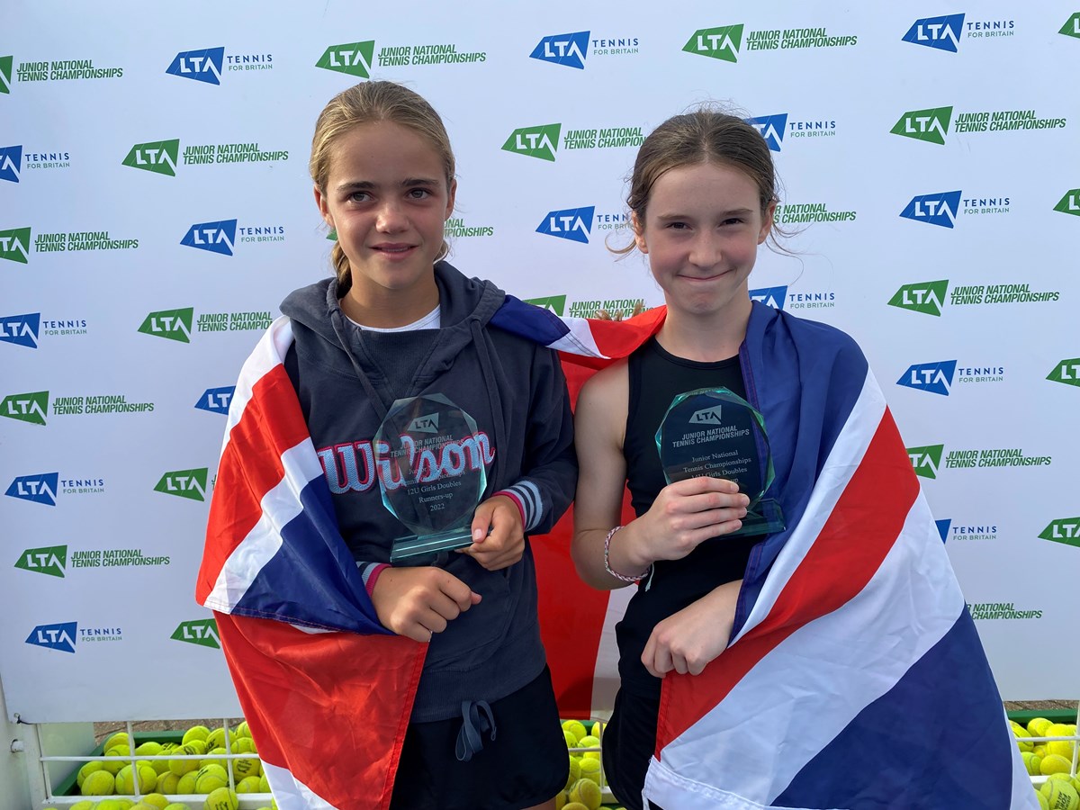 Two under twelve tennis champions