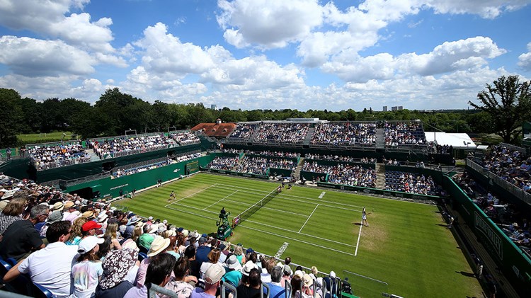 Grass court stadium filled with fans