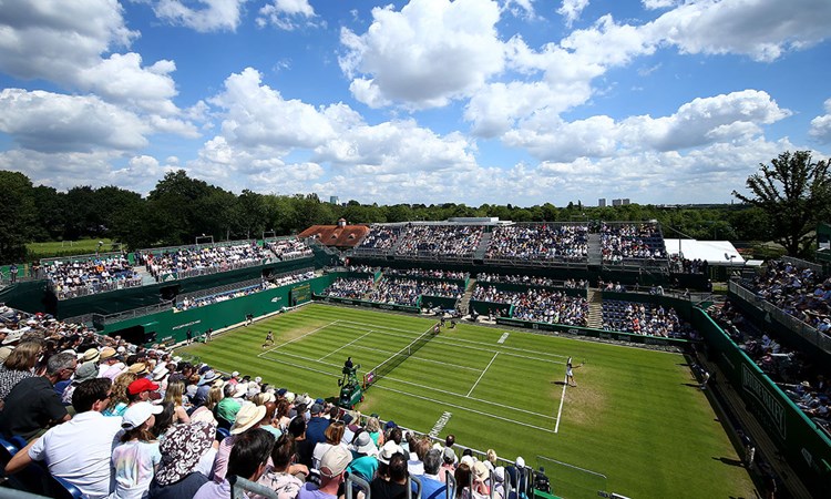 Grass court stadium filled with fans