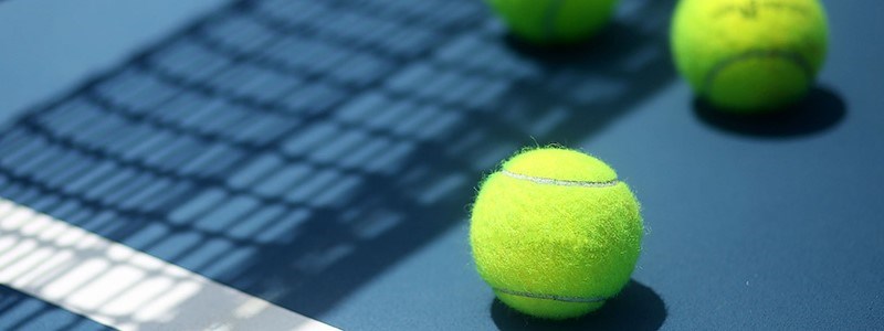 Tennis balls on floor of court