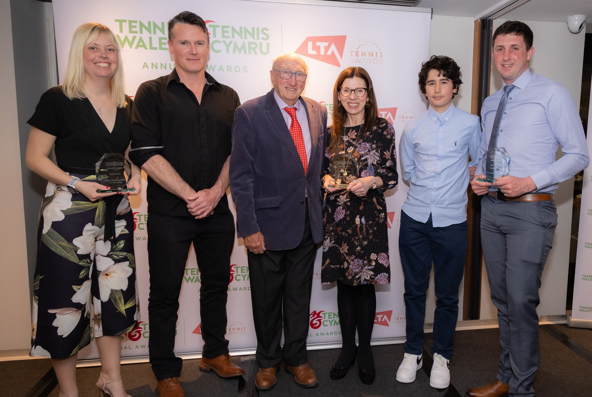 6 people posing for a picture at the disability tennis awards show