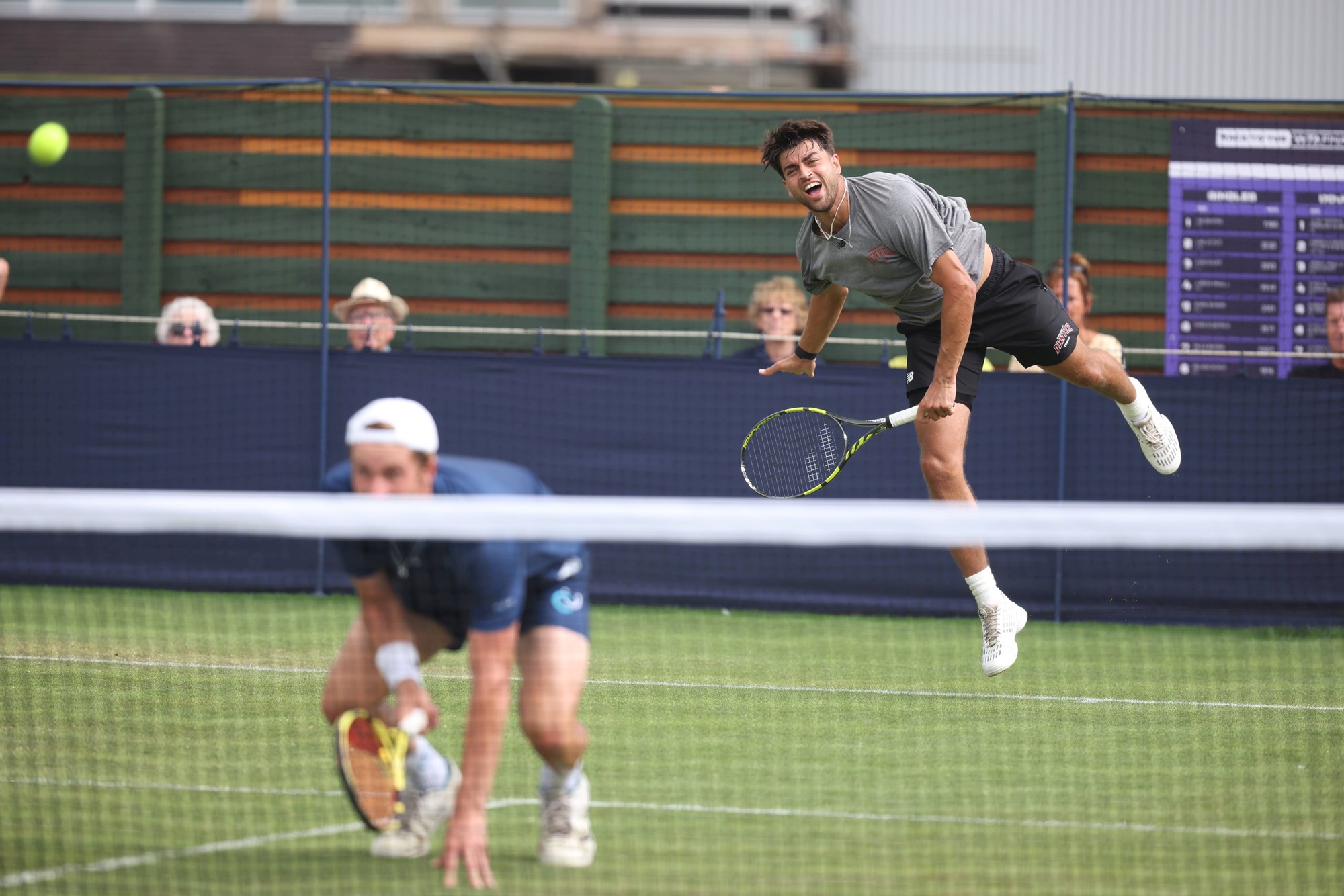 Male tennis player jumping in the air