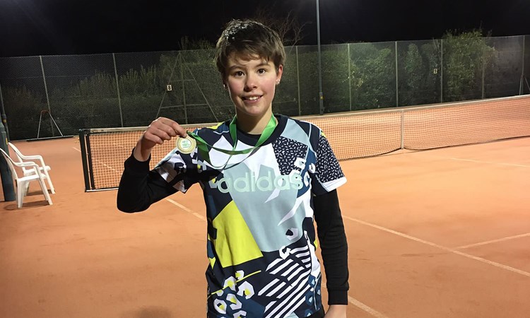 Boy with gold medal in his hand