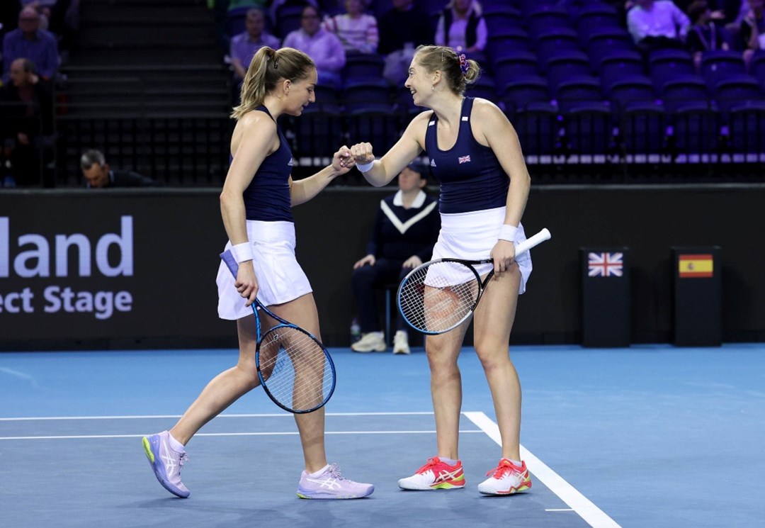 Olivia Nicholls and Alicia Barnett fist bump against Spain at the Billie Jean King Cup