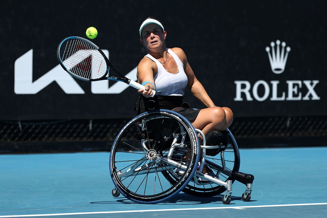 Female tennis player in a wheelchair holding a racket