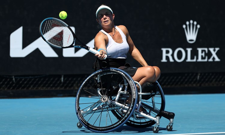 Female tennis player in a wheelchair holding a racket