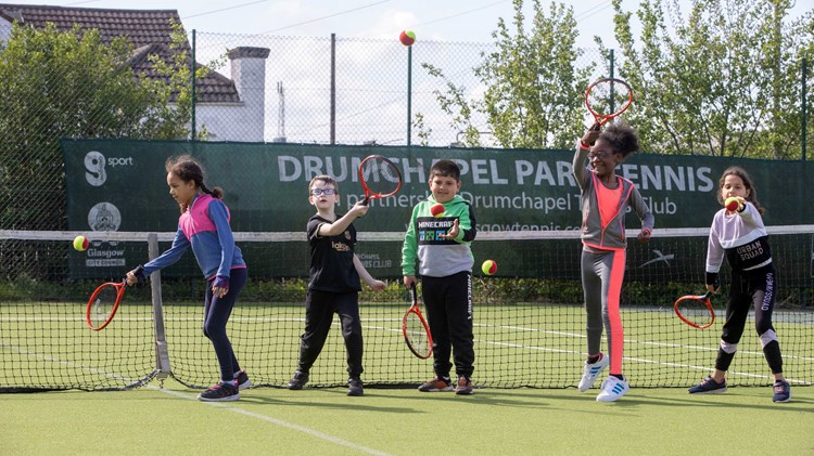 Children playing tennis